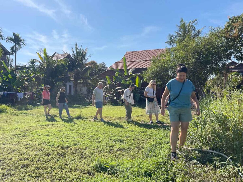 students sourcing ingredients from farm in siem reap
