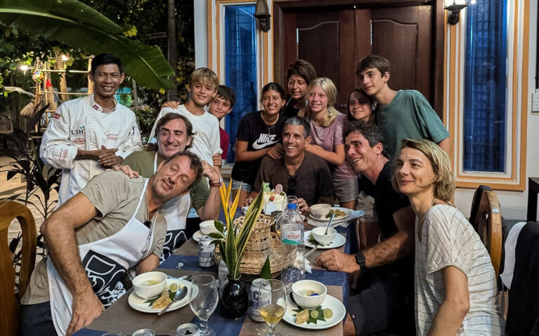 sophos with guests enjoying the khmer cusine from his cooking class in siem reap